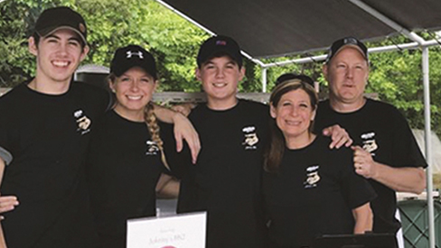 5 people posing for picture